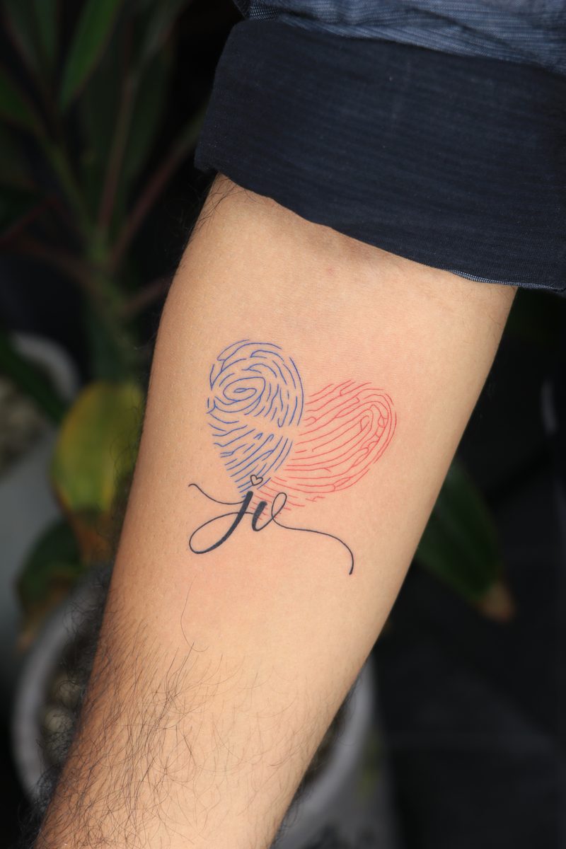 Fingerprint heart with initials fine line tattoo